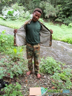 Chap drops his military uniform to show his prick by the river. - Picture 1