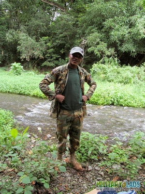 Chap drops his military uniform to show his prick by the river. - Picture 2