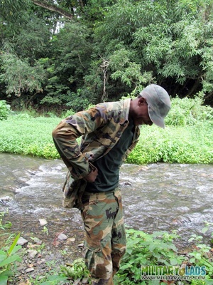 Chap drops his military uniform to show his prick by the river. - Picture 3