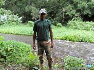 Chap drops his military uniform to show his prick by the river. - Picture 4