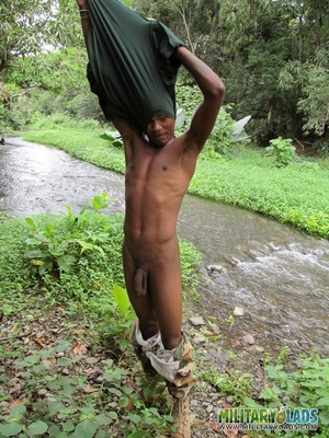 Chap drops his military uniform to show his prick by the river. - Picture 6