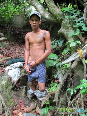 Young man drops his camo gear and gets in the river naked. - Picture 4