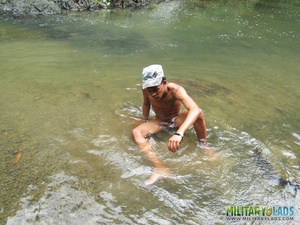 Bloke in a military hat displays his naked body in the river. - XXXonXXX - Pic 1