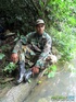 Buddies in camo gear get into some homo action in the river.