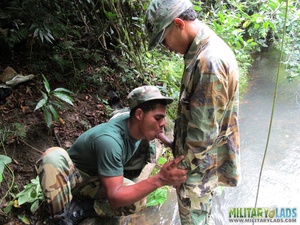 Buddies in camo gear get into some homo action in the river. - Picture 13