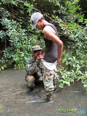 Gay military men take their cock sucking from the river to a log by the river. - Picture 4