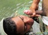 Military lad in camo threads gets a sticky facial in the river.