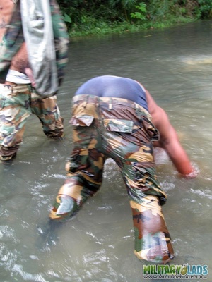 Military lad in camo threads gets a sticky facial in the river. - XXXonXXX - Pic 15
