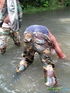 Military lad in camo threads gets a sticky facial in the river.
