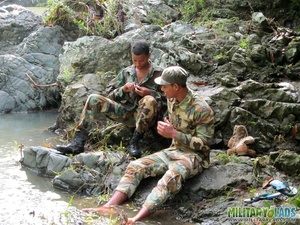 Resting on some rocks turns into a BJ session for a couple of military men. - XXXonXXX - Pic 2