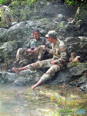 Resting on some rocks turns into a BJ session for a couple of military men. - Picture 3