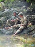 Resting on some rocks turns into a BJ session for a couple of military
