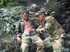 Resting on some rocks turns into a BJ session for a couple of military