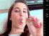 Brunette coed in blue thong sucking her glass dildo before stuffing it