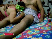 Horny Indian wife in a mask giving handjob to her hubby through his kurta
