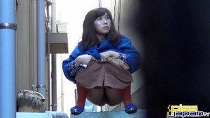 Asian hotties caught pressed on the streets looks for spots to spray piss - Picture 7