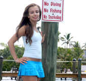 Enticing floozy in a blue bikini BJs on a boat.