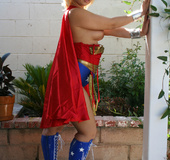 Wide ass blonde sex hero in red and blue super hero costume shows tits