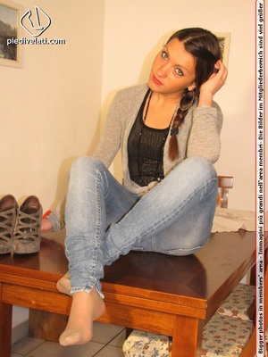 Cute chick in tight blue jeans drops shoes to display sweet cute feet on table - XXXonXXX - Pic 4