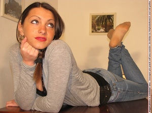 Cute chick in tight blue jeans drops shoes to display sweet cute feet on table - XXXonXXX - Pic 11