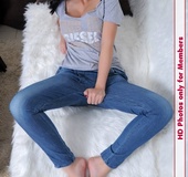 Tasty babe in top and blue jeans displays her clean well taken cared of