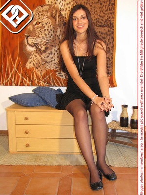 Young tall temptress in black dress, black pantyhose and shoes displays sexy feet - XXXonXXX - Pic 1