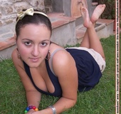 Trollop takes off her sneakers to reveal her bare feet outdoors.