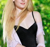Delightful skank in a black teddy gets naked on the patio.