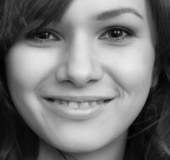 Flawless wench in white nylons sits bare-assed on a brown cabinet.