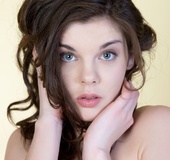 Tempting brunette in yellow lingerie models cute face hot tits and cunt
