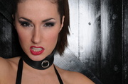 Arousing ponytailed brunette in a leather strap suit gets banged roughly by a dude in cop's cosplay