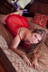 Busty babe in a red transparent  and Venetian mask