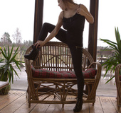 Busty damsel in black strips outdoors to play with tasty big tits and