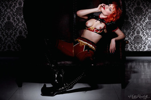 Wild and sexy redhead in spicy red and black latex outfit models her hot body - XXXonXXX - Pic 7