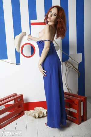 Delish maiden with red hair in a blue dress shows her goodies. - Picture 4