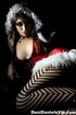 Seductive and hot brunette in red hood jacket and stripped pantyhose looks