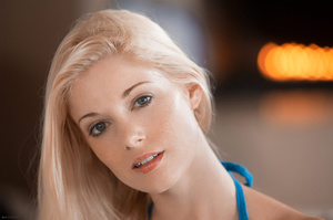 Innocent blonde angel in a blue dress ha - Picture 1
