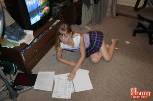 Blonde student in purple plaid pleated skirt pulled away from homework to get fucked on the floor. - Picture 1