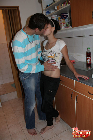 Couple kissing in kitchen results in brunette babe’s snatch licked and fucked on counter. - Picture 2