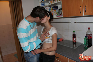 Couple kissing in kitchen results in brunette babe’s snatch licked and fucked on counter. - Picture 3