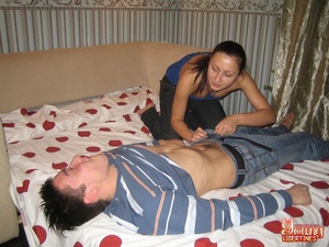 Girl in jeans and a blue top tickles a guy on pullout before treating his cock to a pussy feast. - Picture 5