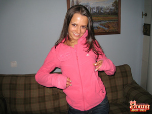 Sexy coed in jeans and a pink sweatshirt strips to reveal striped thong before touching her clit. - XXXonXXX - Pic 1