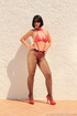 Outdoor shots of a gal in sunglasses, black stockings and red bondage-friendly