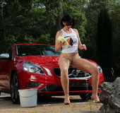 Sex kitten in white tank and nude pantyhose gets herself wet while washing
