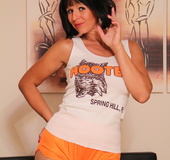 Captivating and coy Hooters waitress shows off her nylon-covered legs