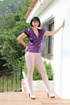 Lady unbuttons purple satin top and reaches into white nylons to pay attention