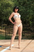 Poolside playmate takes off white bra and panties and touches herself