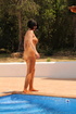 Full-body support hose is rolled down the chest of a whore who just stepped