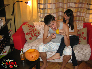 Superb beaver in a white shirt and black pants does some pumpkin carving and some anal in the living room. - Picture 3