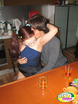 Pigtailed teen girl in glasses gets bent over and fucked on the table - Picture 3